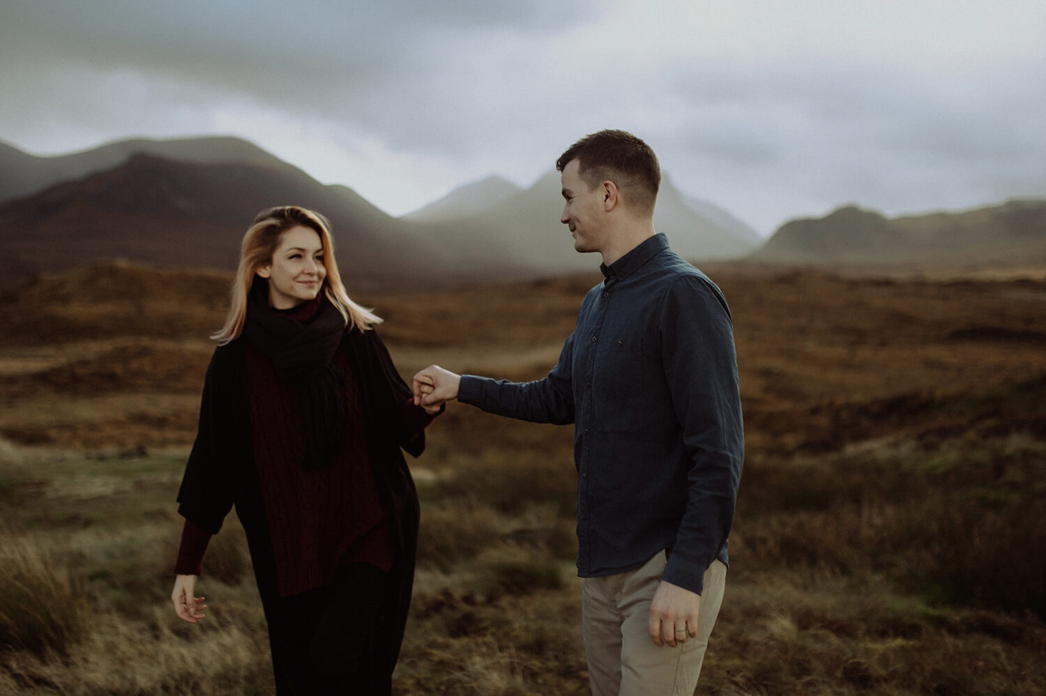 Hand in hand in the Scottish Highlands.