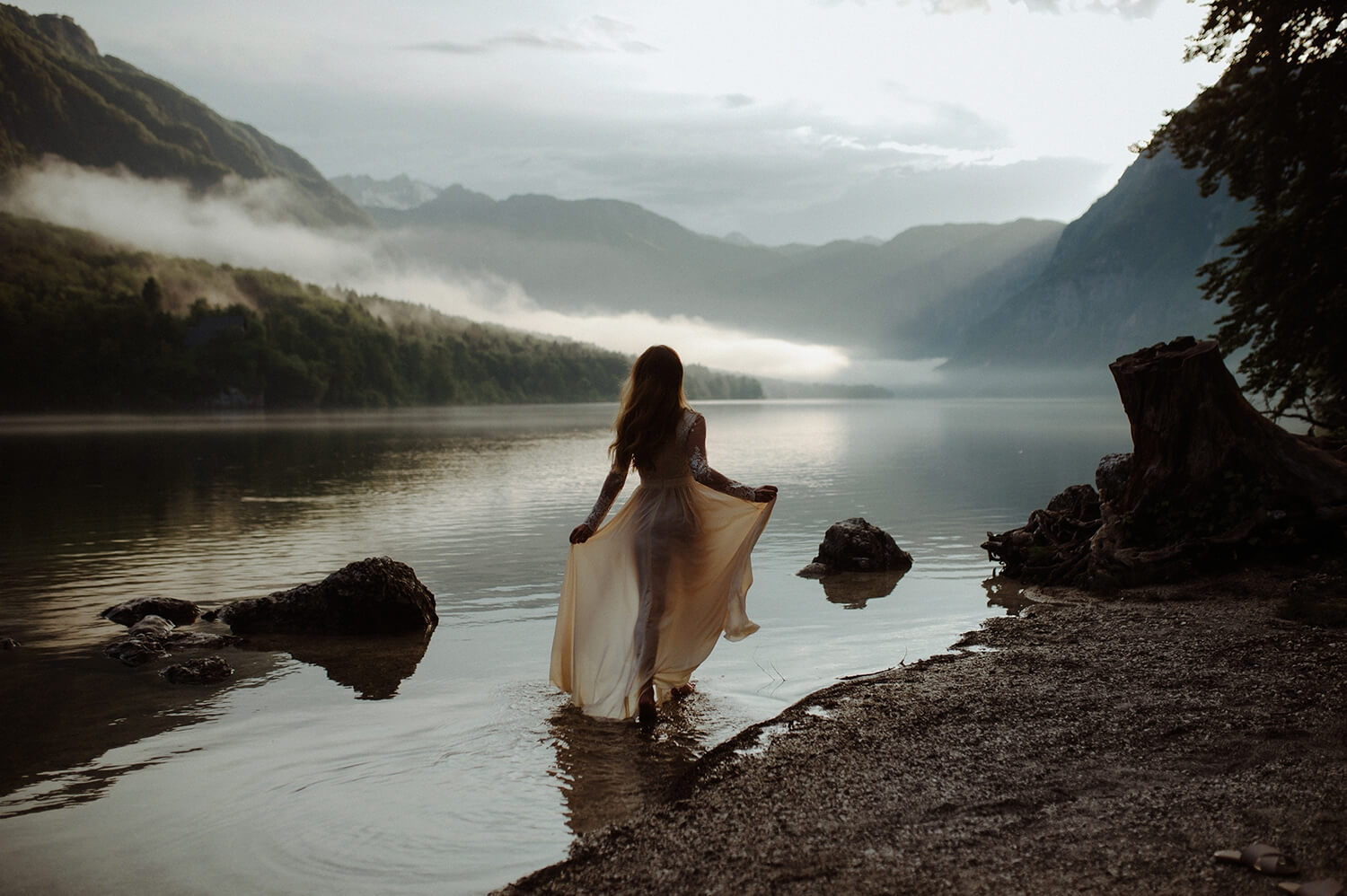 Bride walks into a lake in Slovenia.