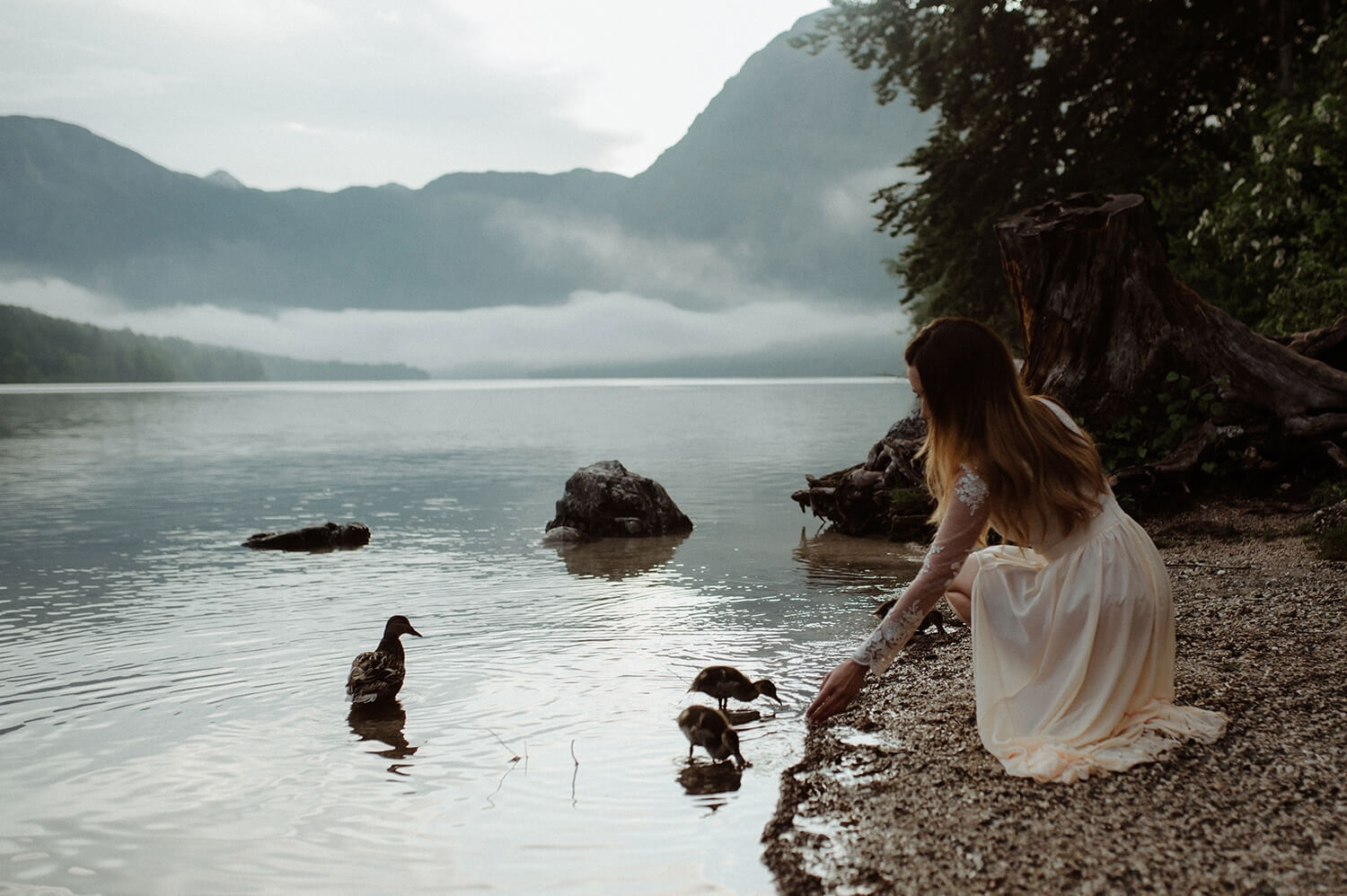 Bride by mountain lake. 