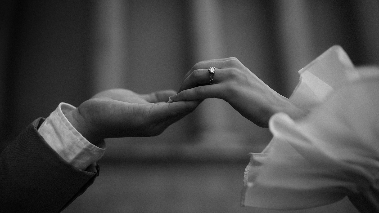 black and white wedding photo of hands 