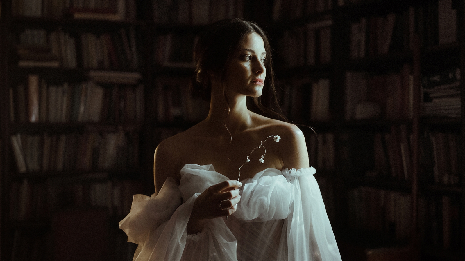 Bride in a library on her wedding
